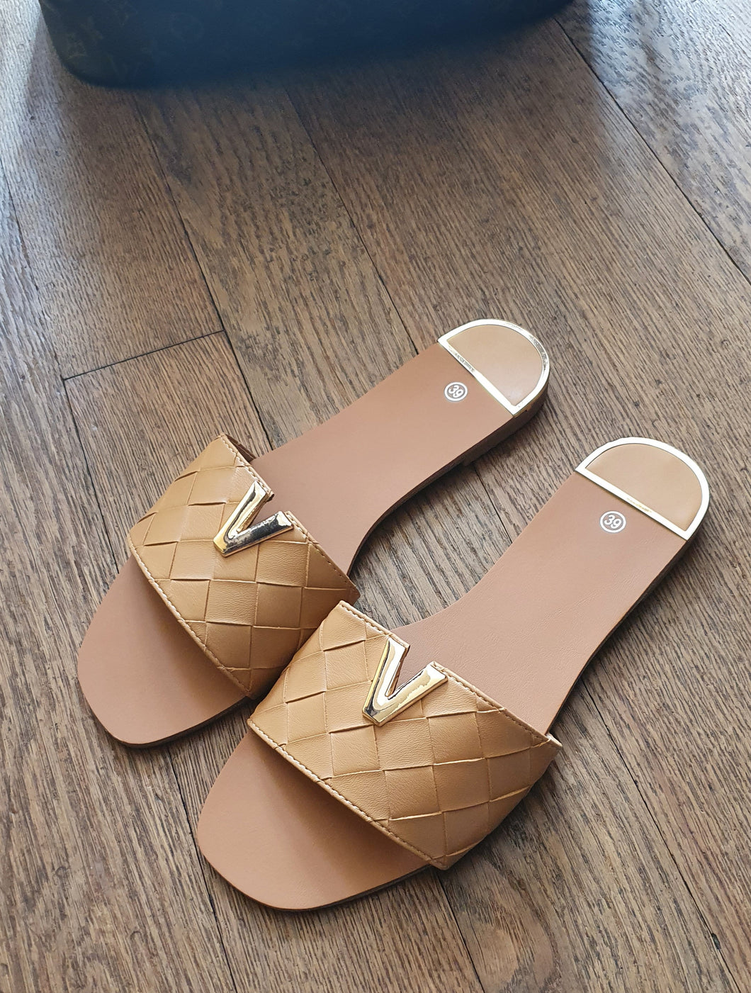 Tan V Logo Sliders
